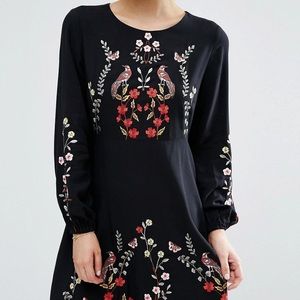 Embroidered skater dress with birds and flowers.